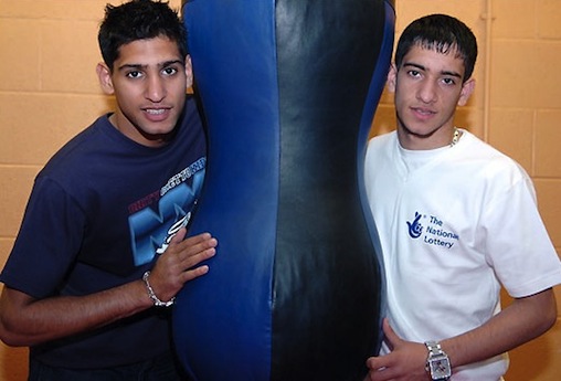 HERO: Amir Khan (right) is Bolton's favourite sporting son after his Olympic boxing silver as a teenager in Athens. He is tipped to be involved as the flame passes through his home town  