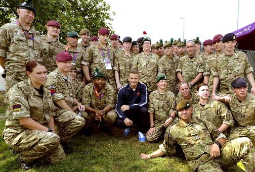 BECKHAM'S ARMY: David Beckham poses with members of the army who are assisting with security during the Olympic Games