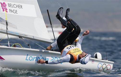 MAN OVERBOARD: Australia's Mathew Belcher and Malcolm Page celebrate as they win gold in the men's 470 sailing class. Team GB's Luke Patience and Stuart Bithell claim silver. 