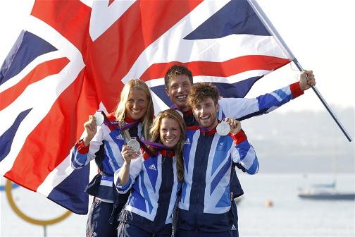 CREST OF A WAVE: Saskia Clark, Hannah Mills, Stuart Bithell and Luke Patience pose with their silver medals earned in their respective 470 class sailing events