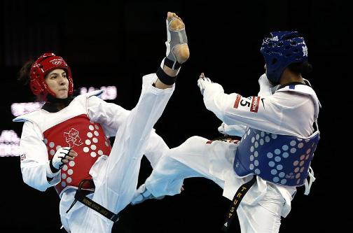 DEFEAT: -Great Britain's Sarah Stevenson in red loses to the USA's Paige McPherson in her 67kg taekwondo bout