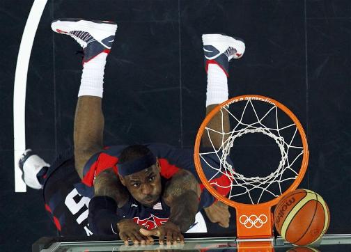 GAME ON: Lebron James and his USA team-mates are currently fighting it out with Argentina for a place in the basketball final